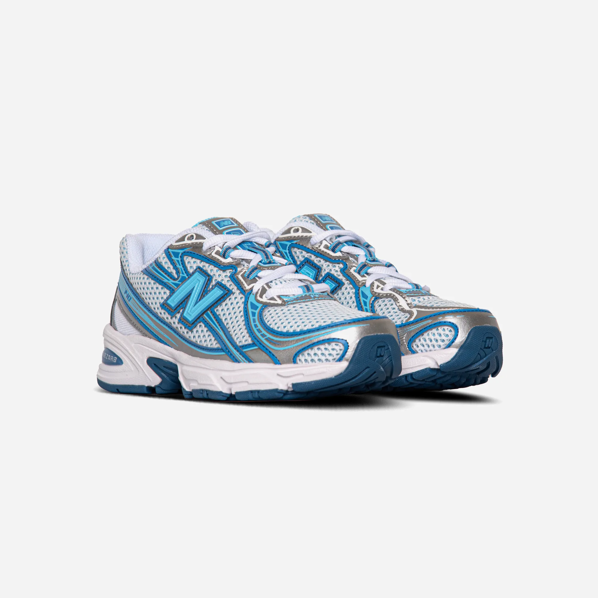 New Balance 740v2 Blue Agate White running in a forest shoes