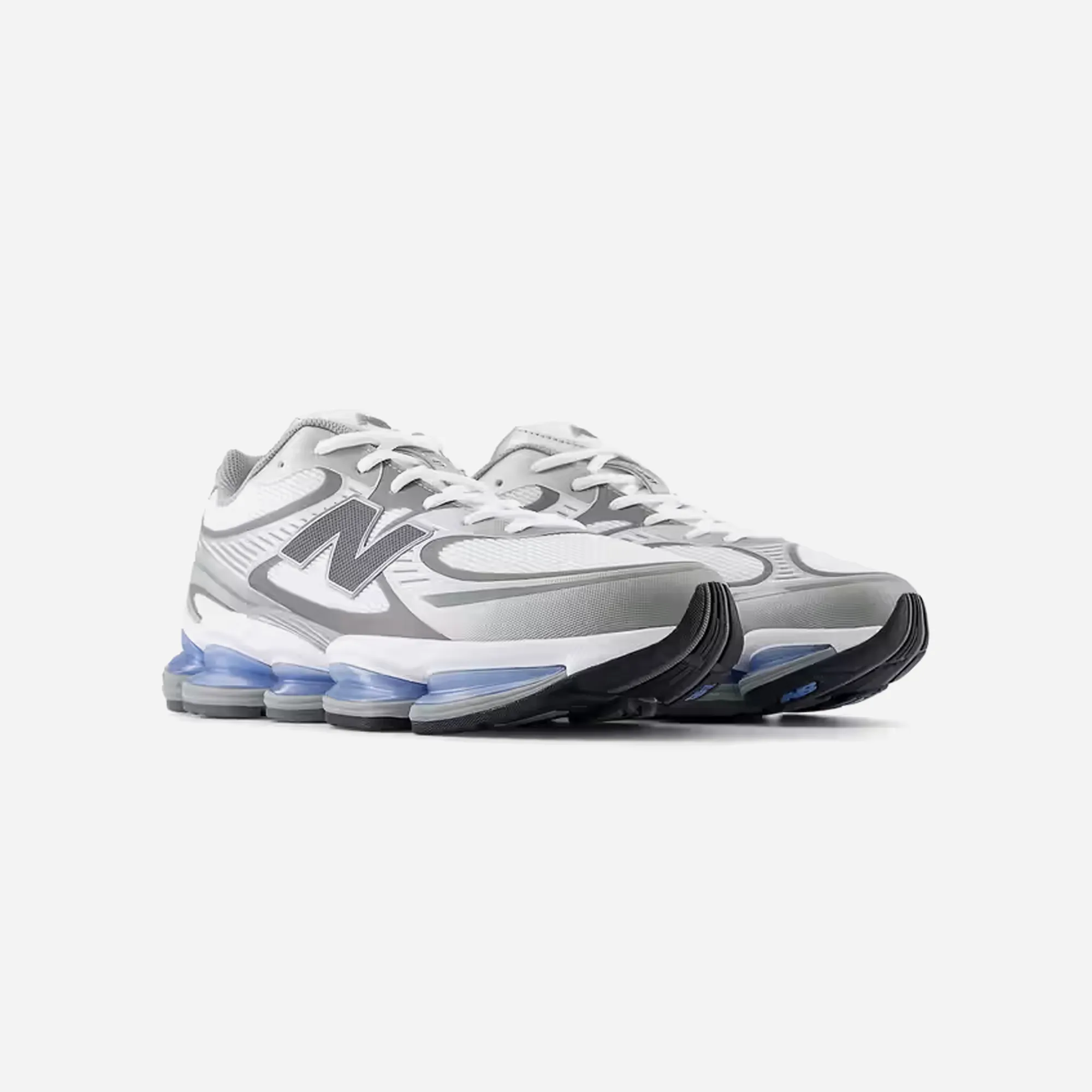 New Balance Abzorb 2000 White Grey Blue adventure - themed shoes running in a neighborhood