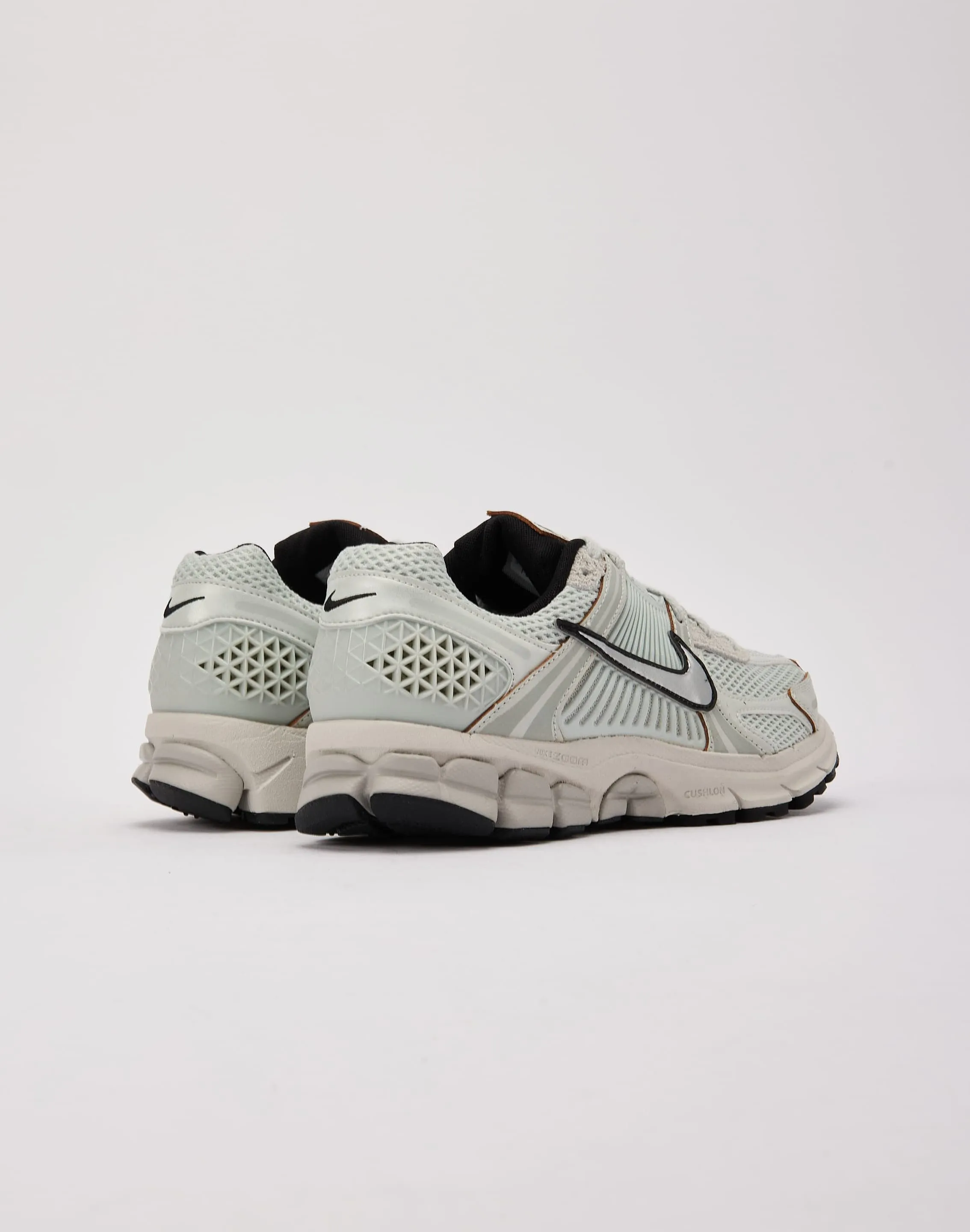 running with a whistle enthusiasm - generating Nike Zoom Vomero 5