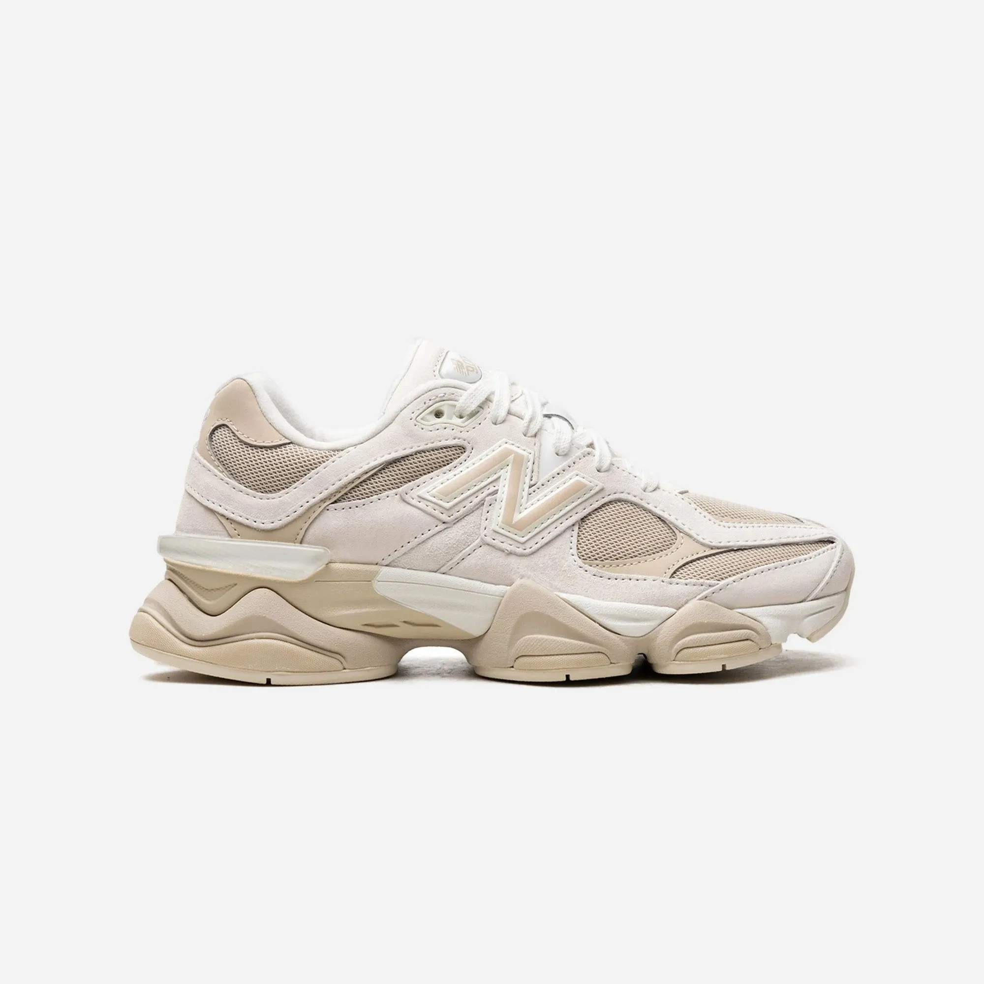 running in a forest running for a way to stay active New Balance 9060 Beige White